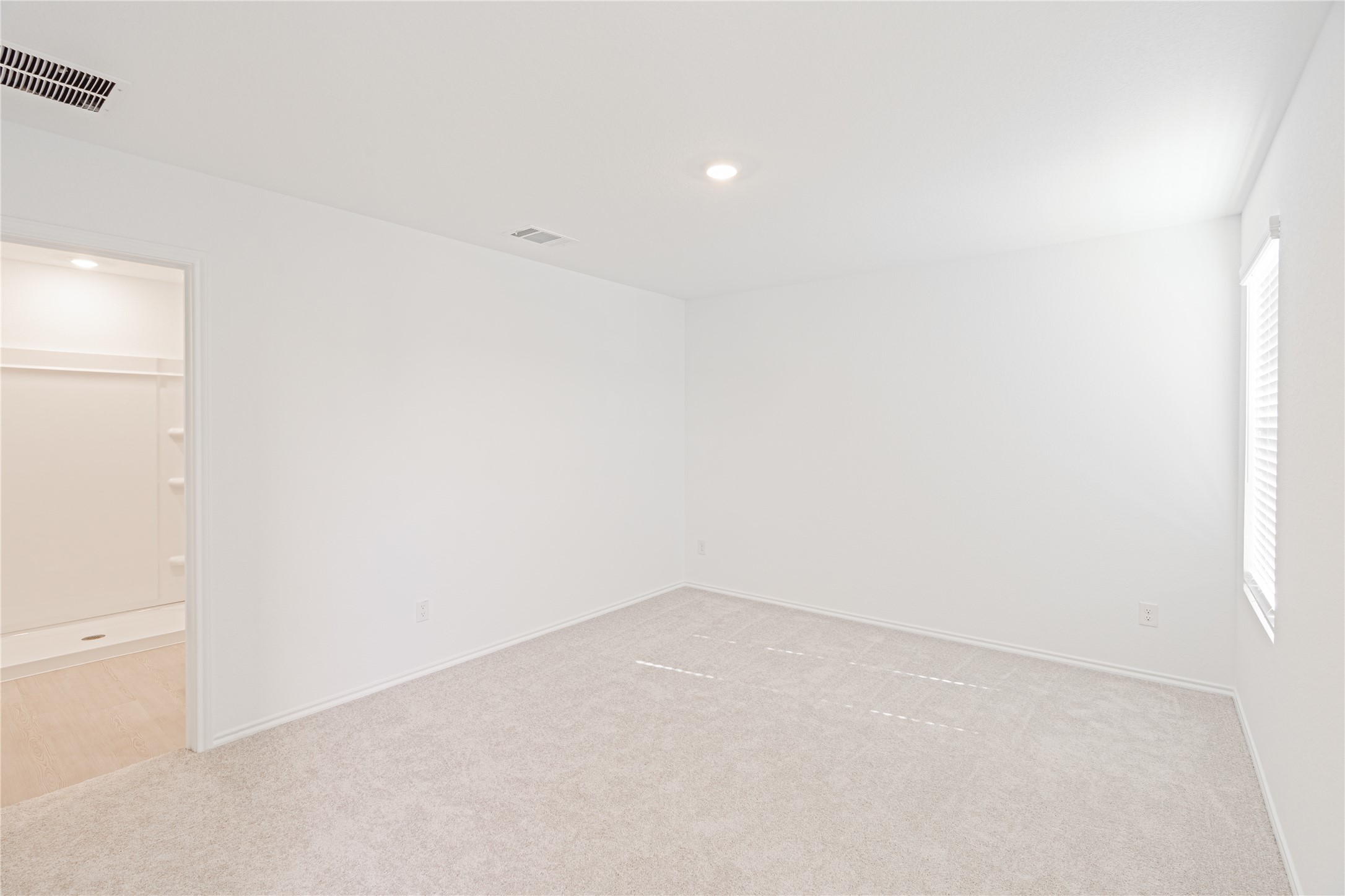 117 Dark Victory Road Jarrell, TX 76537 - Photo 8 of 24 Empty room featuring light colored carpet and recessed lighting
