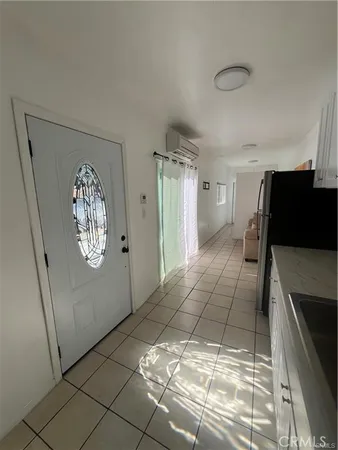 a view of entryway with kitchen