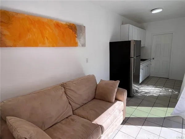 a living room with a couch and a stove