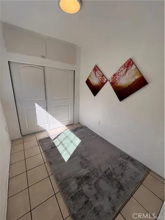 a view of an empty room and wooden floor