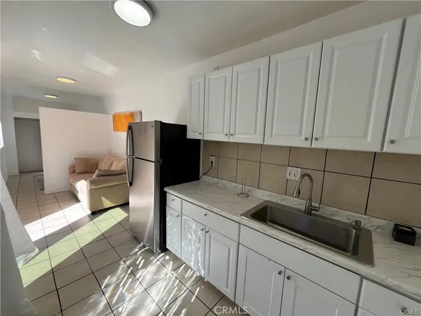 a kitchen with a sink and cabinets