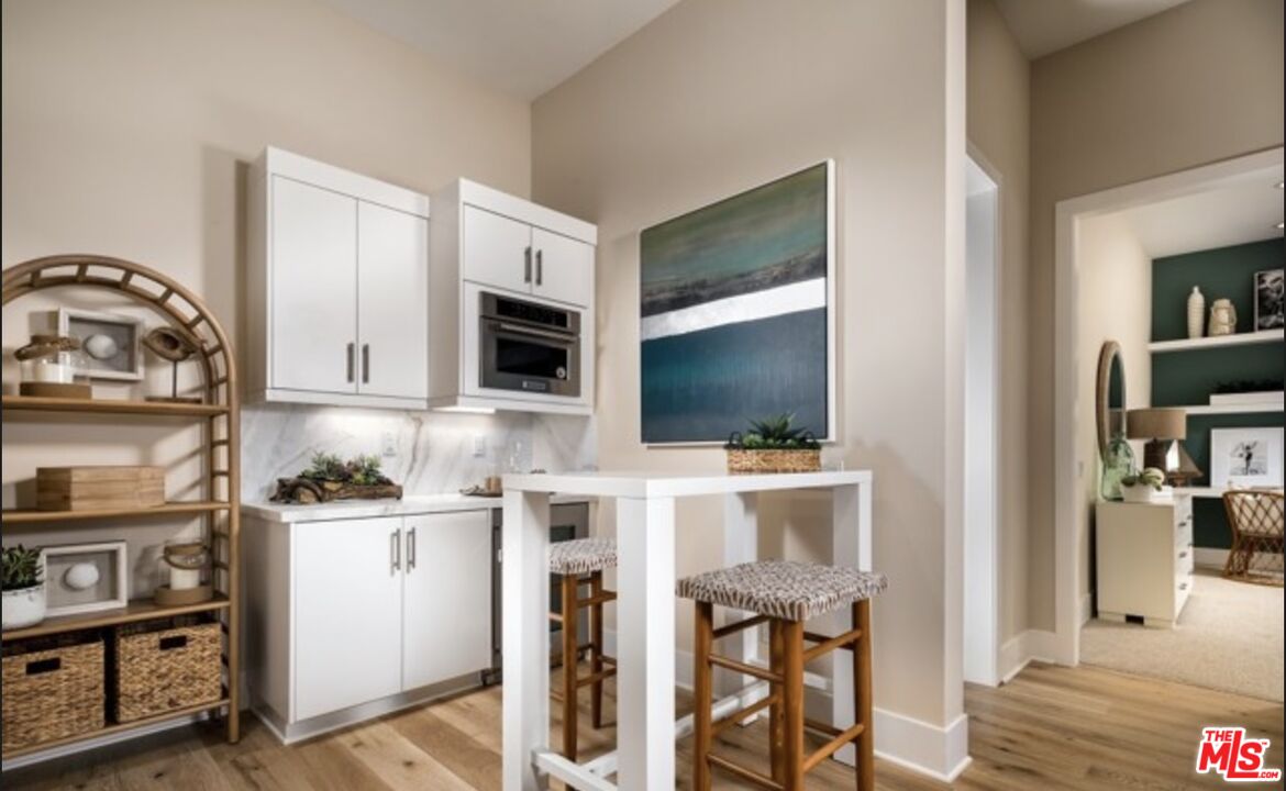 20400 Marlow Lane Porter Ranch, CA 91326 - Photo 11 of 21 a living room with stainless steel appliances furniture and a flat screen tv