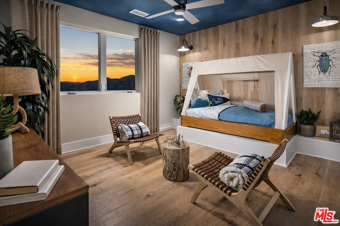 20400 Marlow Lane Porter Ranch, CA 91326 - Photo 20 of 21 a bedroom with a bed and a chandelier