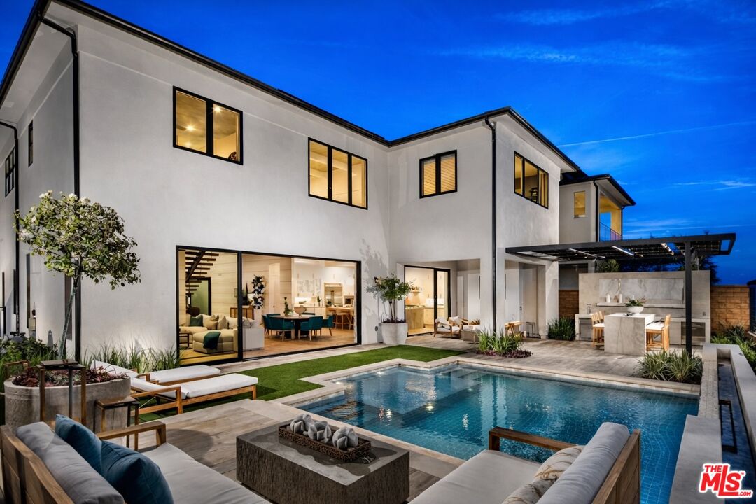 20400 Marlow Lane Porter Ranch, CA 91326 - Photo 2 of 21 a view of a house with swimming pool and sitting area