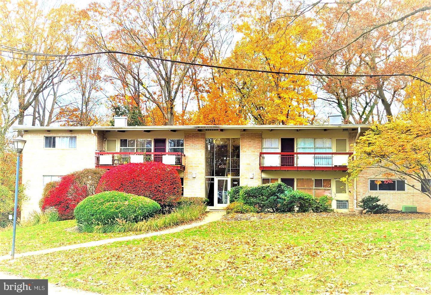 front view of a building with a yard