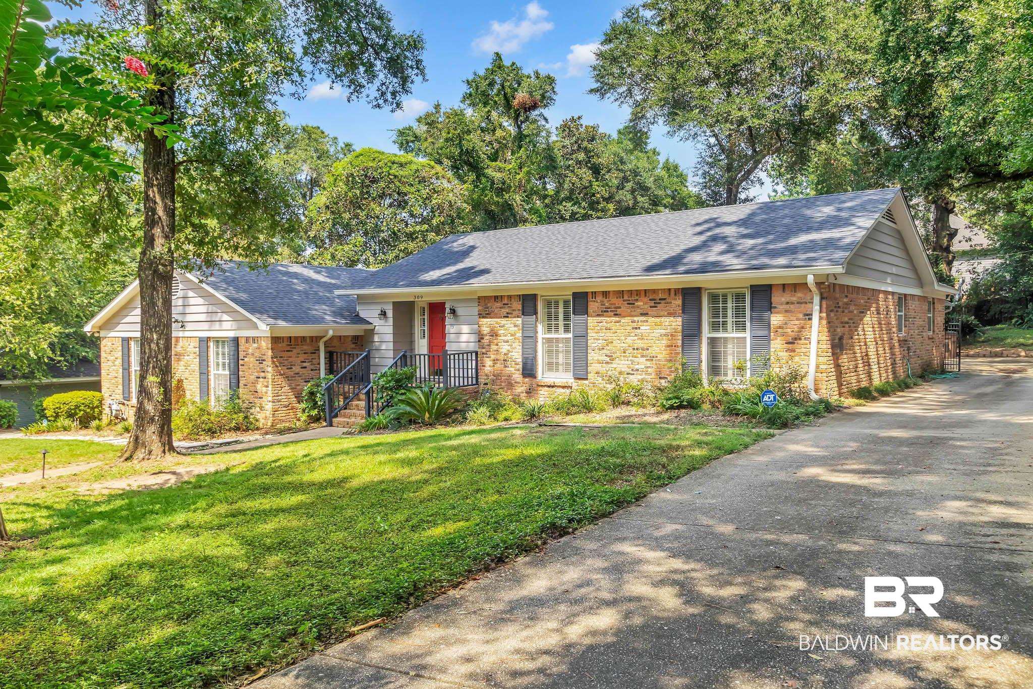309 West Brandy Run Road Mobile, AL 36608 - Photo 4 of 100 Ranch-style home with brick siding, driveway, a front yard, and a shingled roof