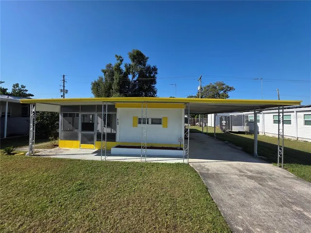 swimming pool view with a seating space and a garden view