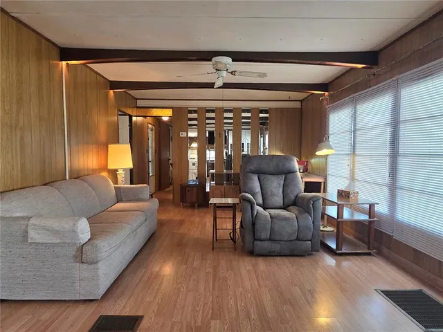 a kitchen with stainless steel appliances a stove a refrigerator and a fireplace