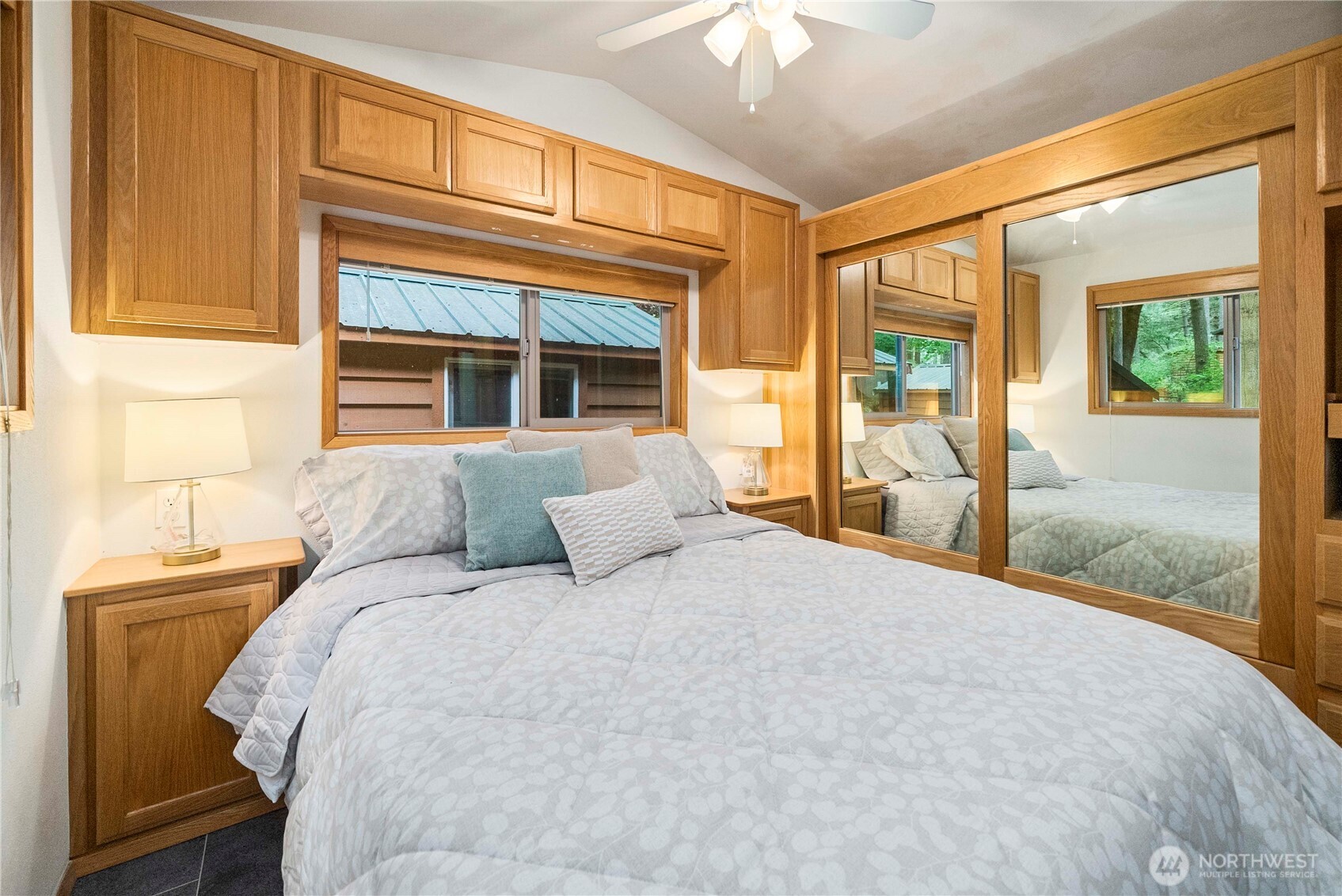 1546 Reservation Road Southeast, Unit 62 Olympia, WA 98513 - Photo 12 of 39 a bedroom with a large bed and a window