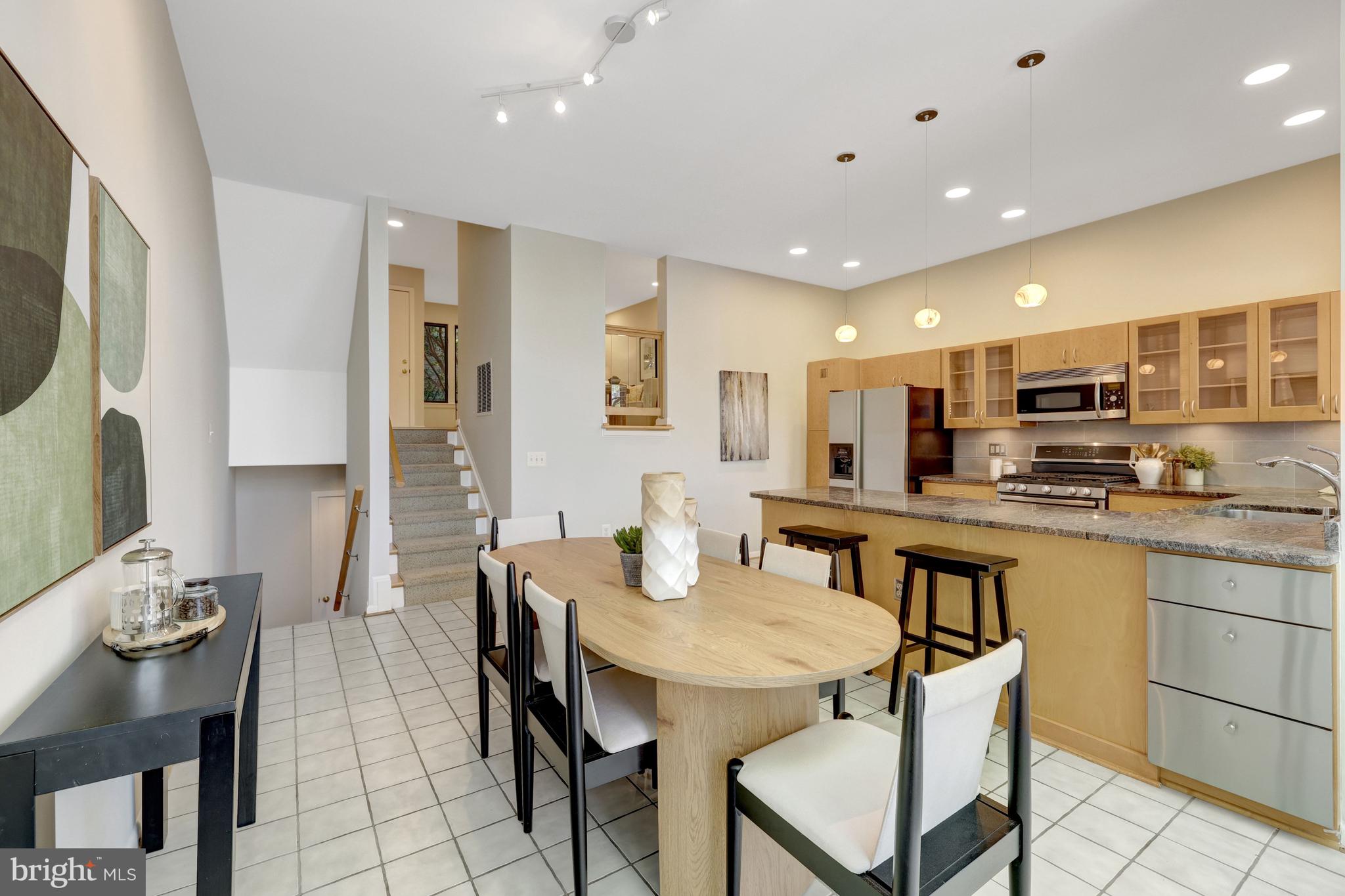11024 Thrush Ridge Road Reston, VA 20191 - Photo 10 of 63 Stairs lead from the living room to the kitchen.