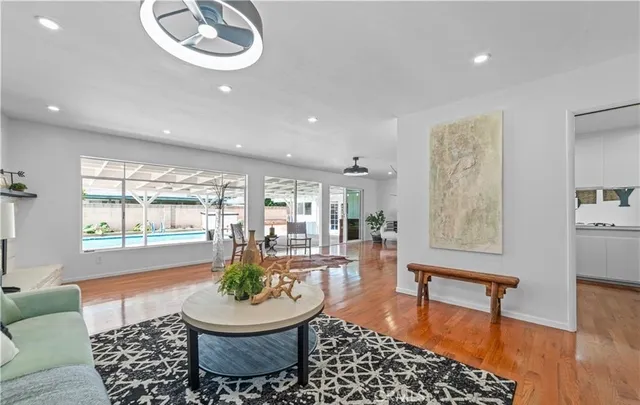 a living room with furniture and a large window