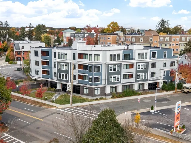 a view of a building with a lot of trees and buildings