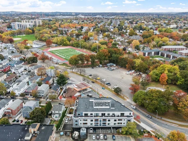 an aerial view of residential houses with outdoor space