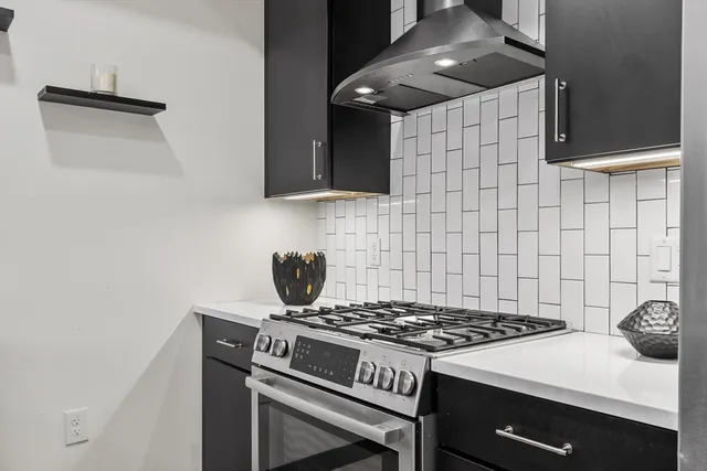 a kitchen with a sink and a refrigerator