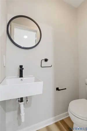 a bathroom with a sink and mirror