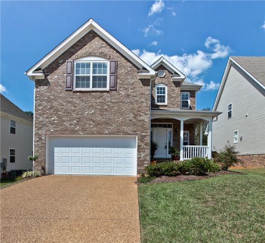 1167 Cynthia Lane Spring Hill, TN 37174 - Photo 1 of 20 a front view of a house with yard