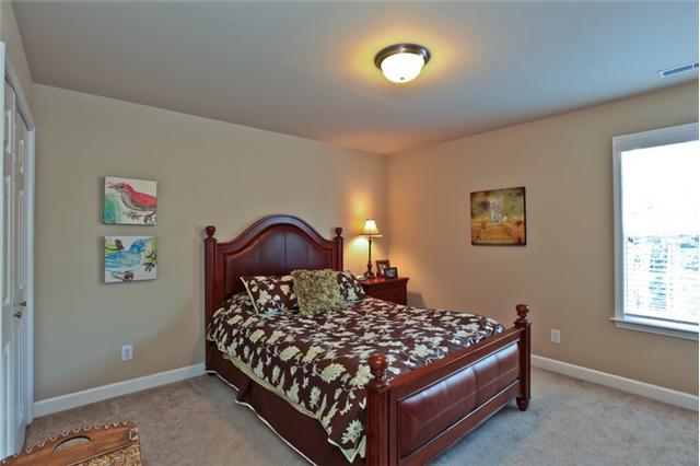 1167 Cynthia Lane Spring Hill, TN 37174 - Photo 13 of 20 a bedroom with a bed and a window
