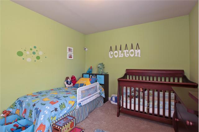 1167 Cynthia Lane Spring Hill, TN 37174 - Photo 14 of 20 a bedroom with a bed and a window