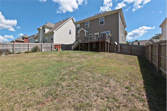 1167 Cynthia Lane Spring Hill, TN 37174 - Photo 18 of 20 a view of a house with a yard