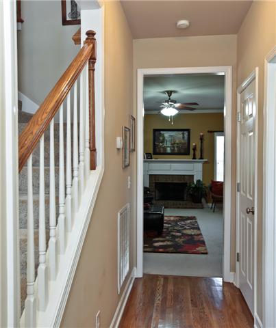 1167 Cynthia Lane Spring Hill, TN 37174 - Photo 3 of 20 a view of a hallway view with wooden floor and staircase