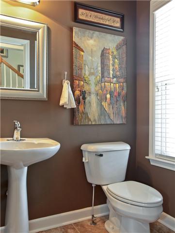 1167 Cynthia Lane Spring Hill, TN 37174 - Photo 8 of 20 a bathroom with a toilet a sink and a mirror