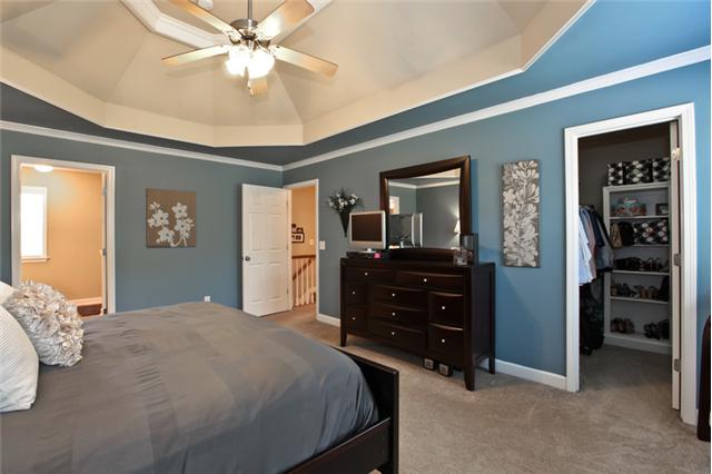 1167 Cynthia Lane Spring Hill, TN 37174 - Photo 10 of 20 a bedroom with a bed and a chandelier