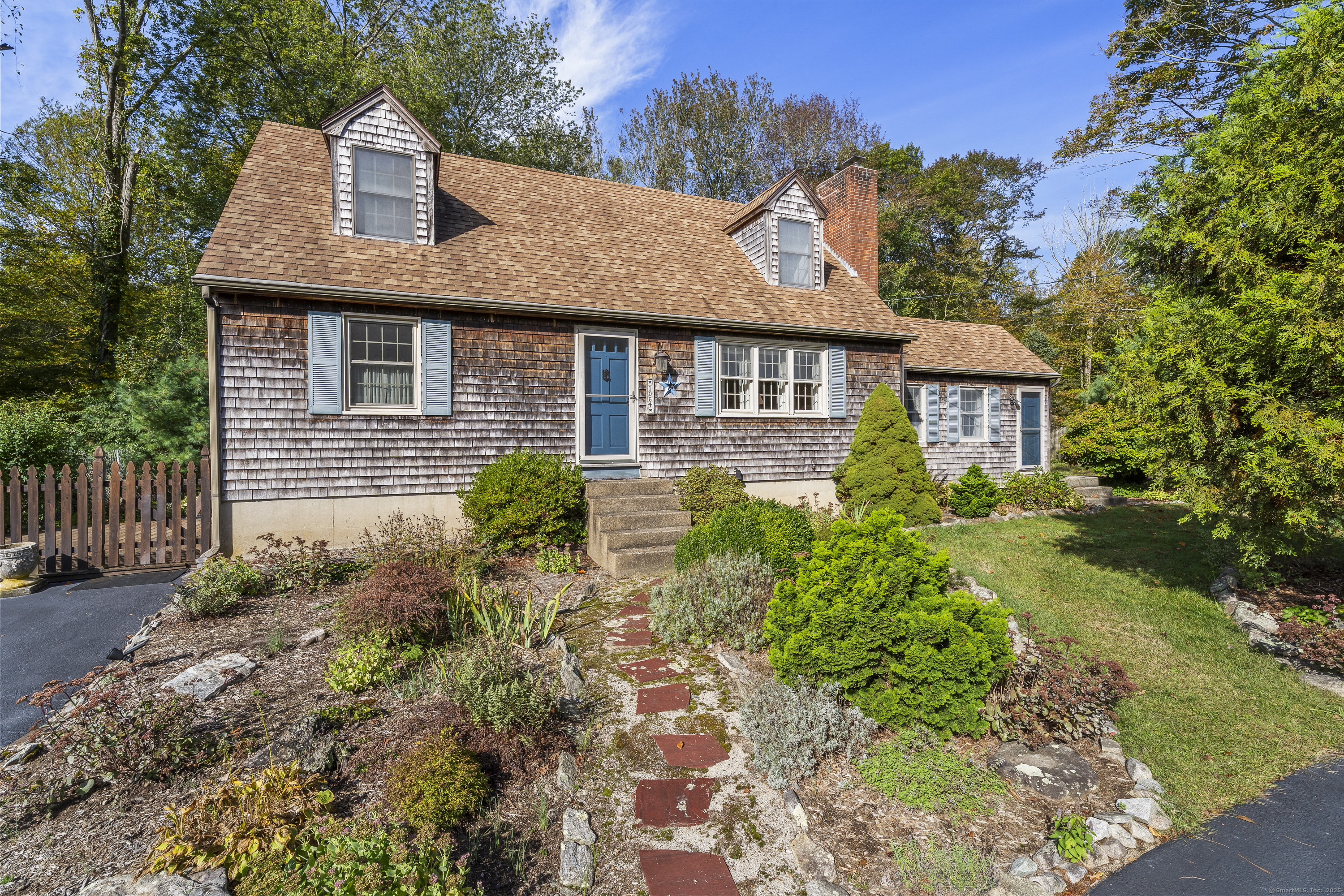 1064 N Road Groton, CT 06340 - Photo 1 of 1 a front view of a house with a yard