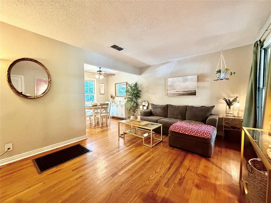 919 Denton Street Denton, TX 76201 - Photo 3 of 19 a living room with furniture and a wooden floor