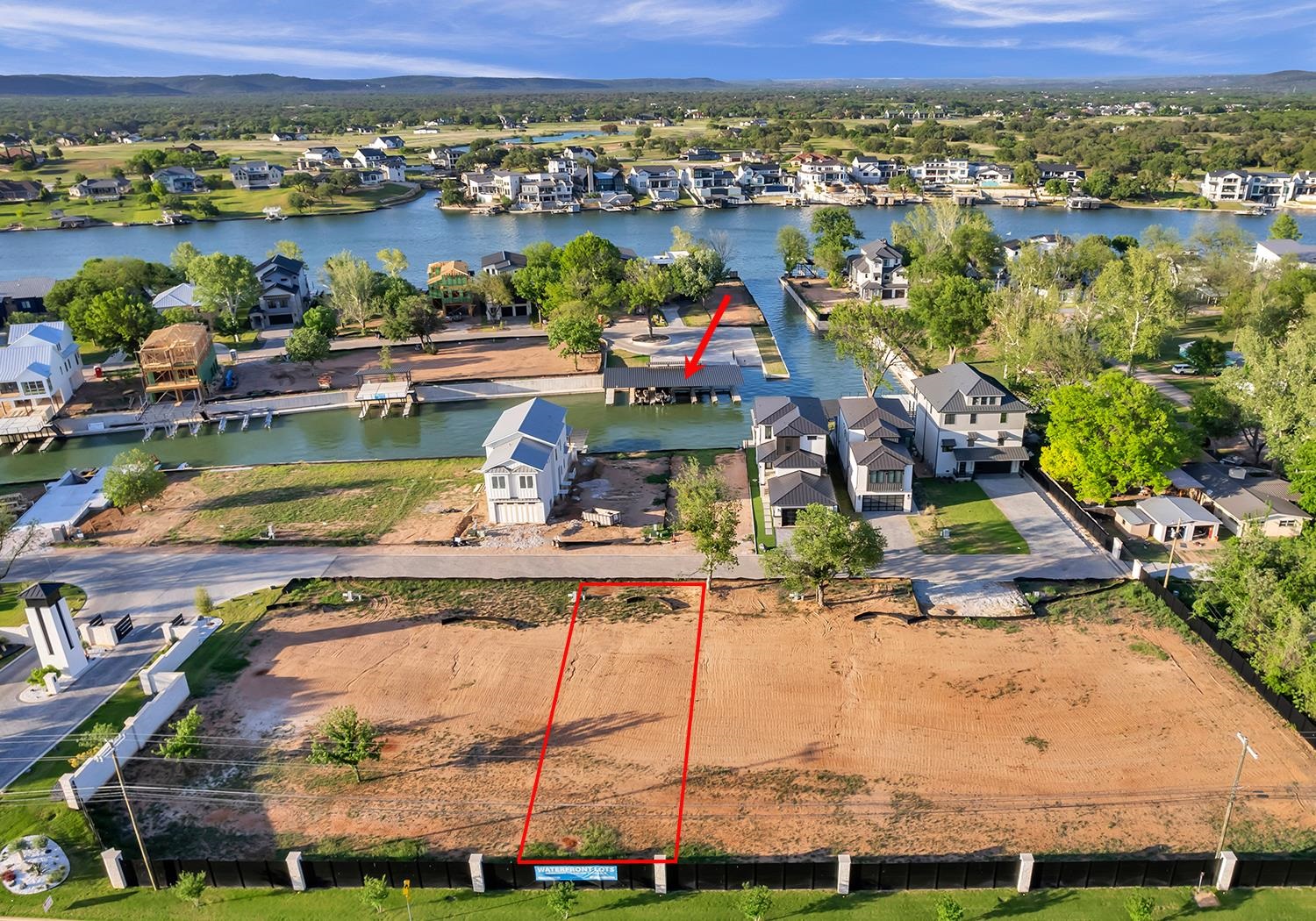 an aerial view of a house with a lake view