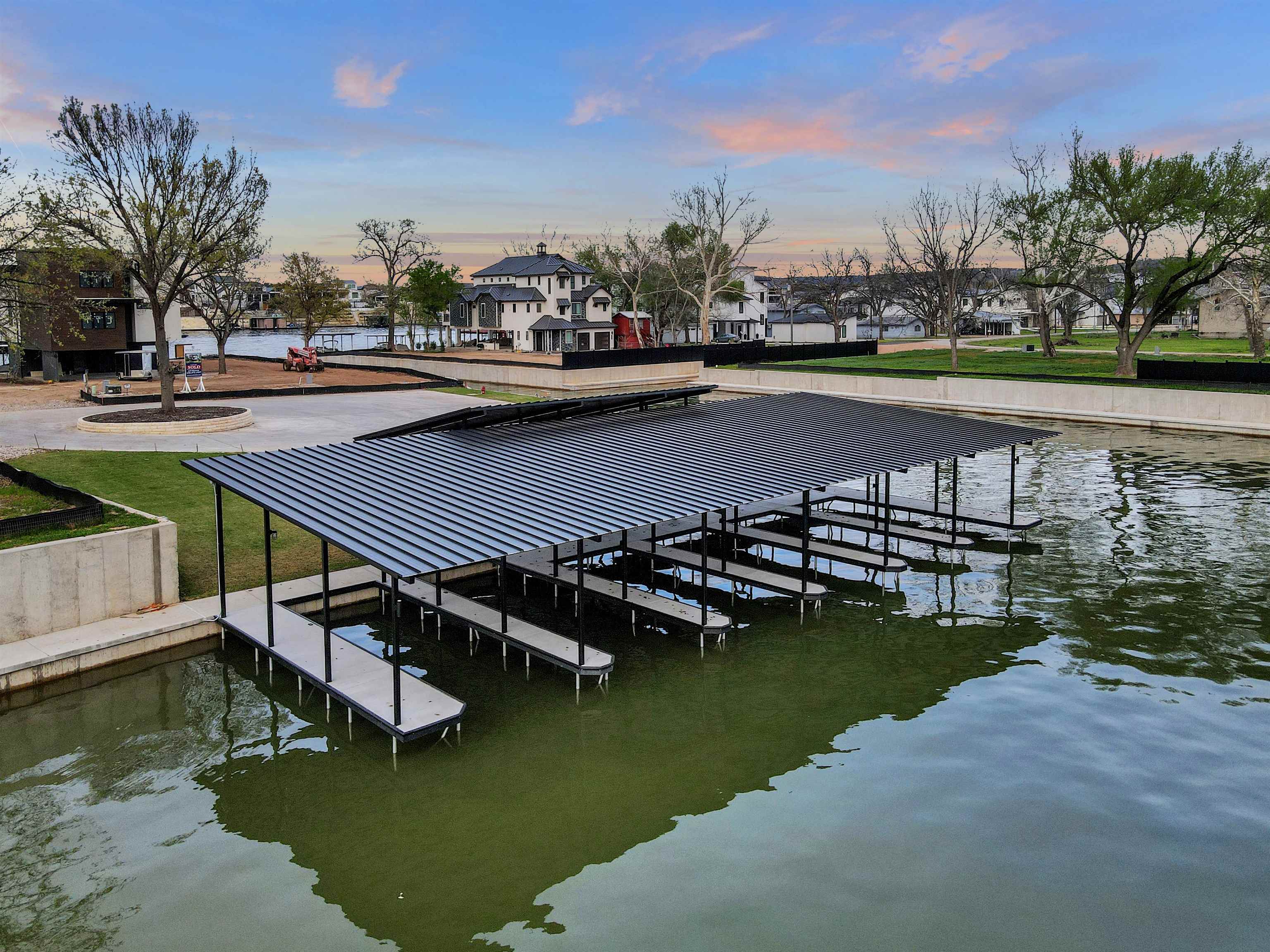 4 Lake Street Kingsland, TX 78639 - Photo 2 of 17 a view of a lake with a yard and large trees