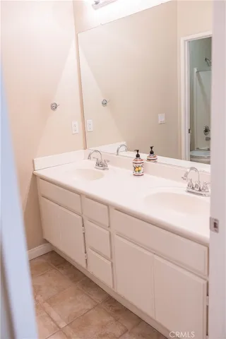 a view of a porch with chairs and potted plants