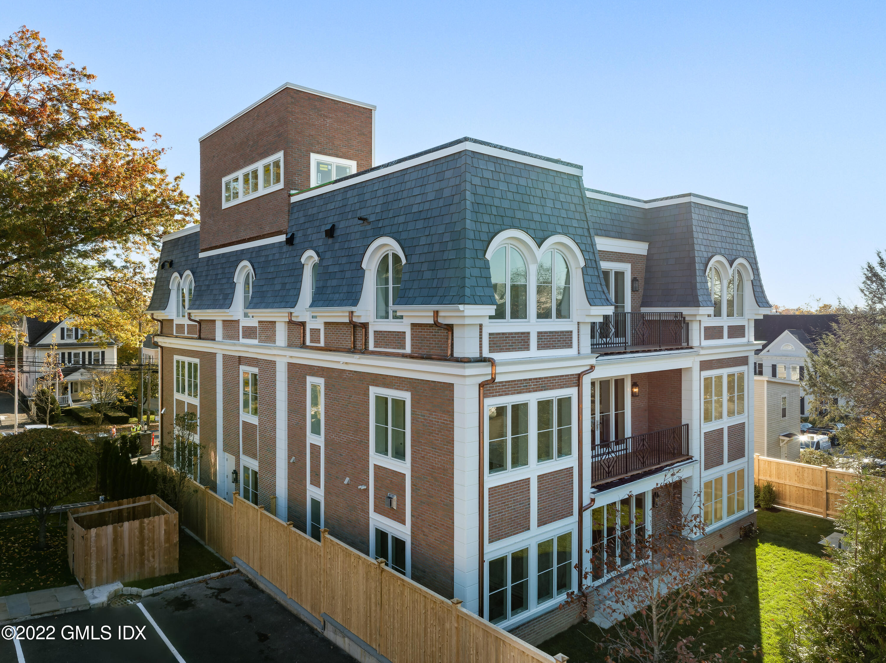 62 Mason Street, Unit 2W Greenwich, CT 06830 - Photo 15 of 18 a front view of a house with a yard