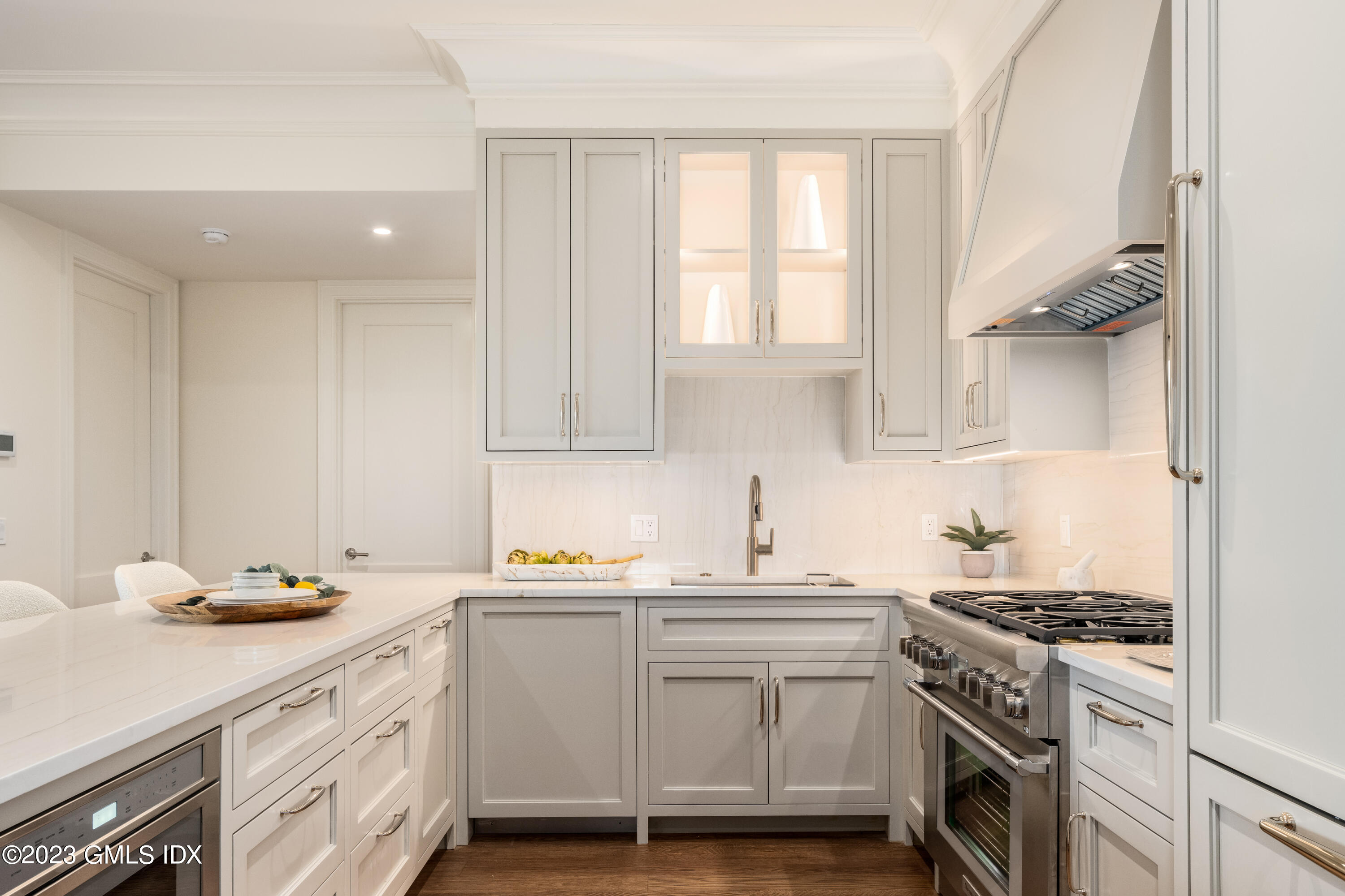 62 Mason Street, Unit 2W Greenwich, CT 06830 - Photo 6 of 18 a kitchen with cabinets appliances a sink and a window