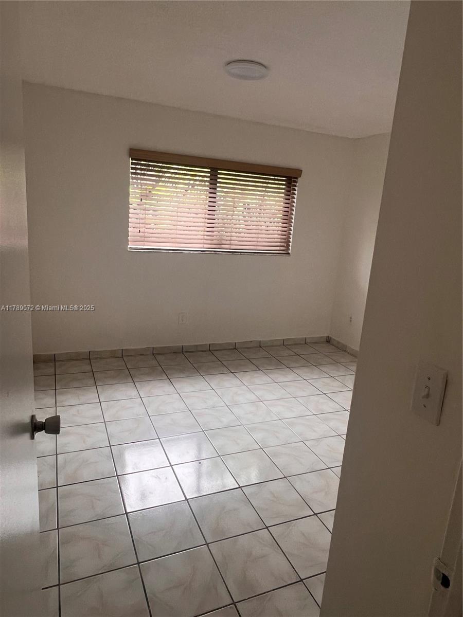 10851 Southwest 2nd Street, Unit K304 Sweetwater, FL 33174 - Photo 7 of 16 a view of room and window