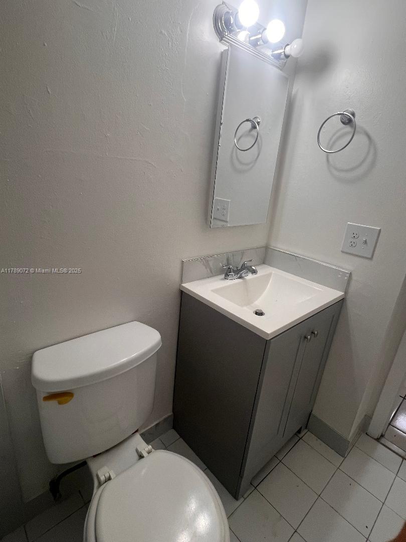 10851 Southwest 2nd Street, Unit K304 Sweetwater, FL 33174 - Photo 10 of 16 a white toilet sitting next to a bathroom sink