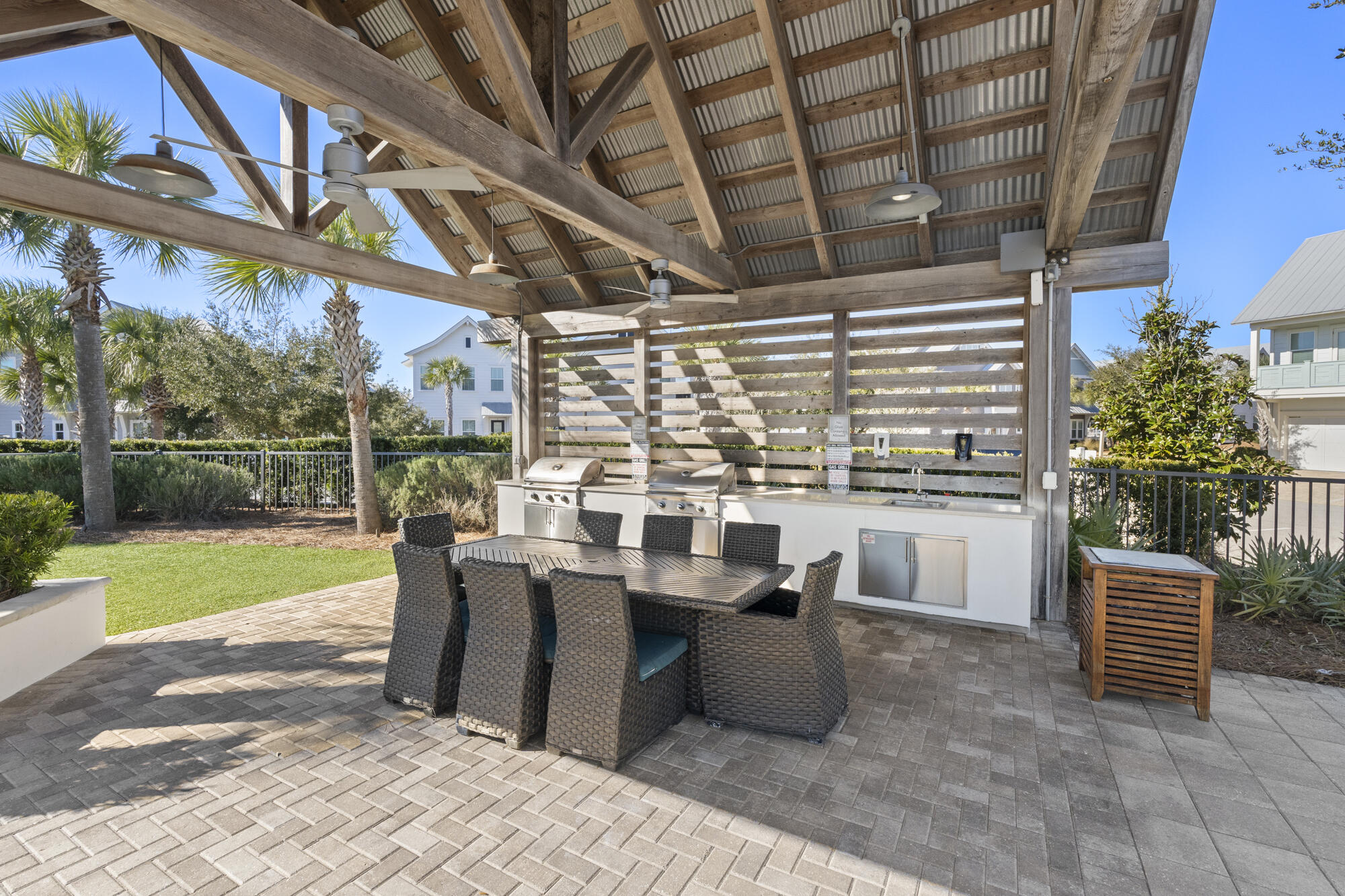 144 Wharf Ln Inlet Beach, Unit A Inlet Beach, FL 32461 - Photo 18 of 48 a view of a porch with chairs and backyard