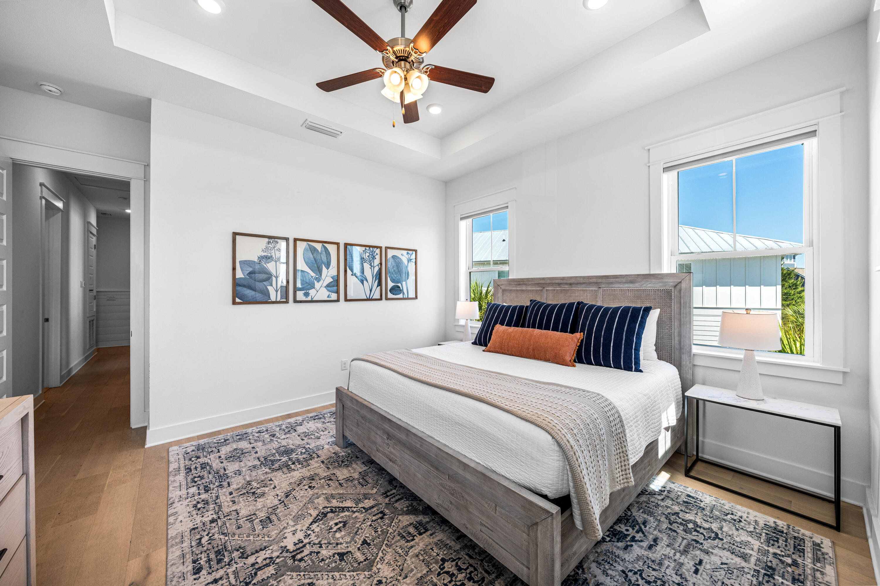 144 Wharf Ln Inlet Beach, Unit A Inlet Beach, FL 32461 - Photo 22 of 48 a bedroom with a large bed and a chandelier