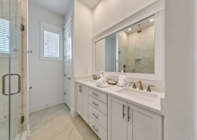 144 Wharf Ln Inlet Beach, Unit A Inlet Beach, FL 32461 - Photo 25 of 48 a bathroom with double sink and a mirror