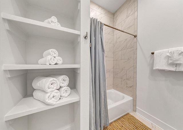 144 Wharf Ln Inlet Beach, Unit A Inlet Beach, FL 32461 - Photo 31 of 48 a bathroom with a bathtub and a shower