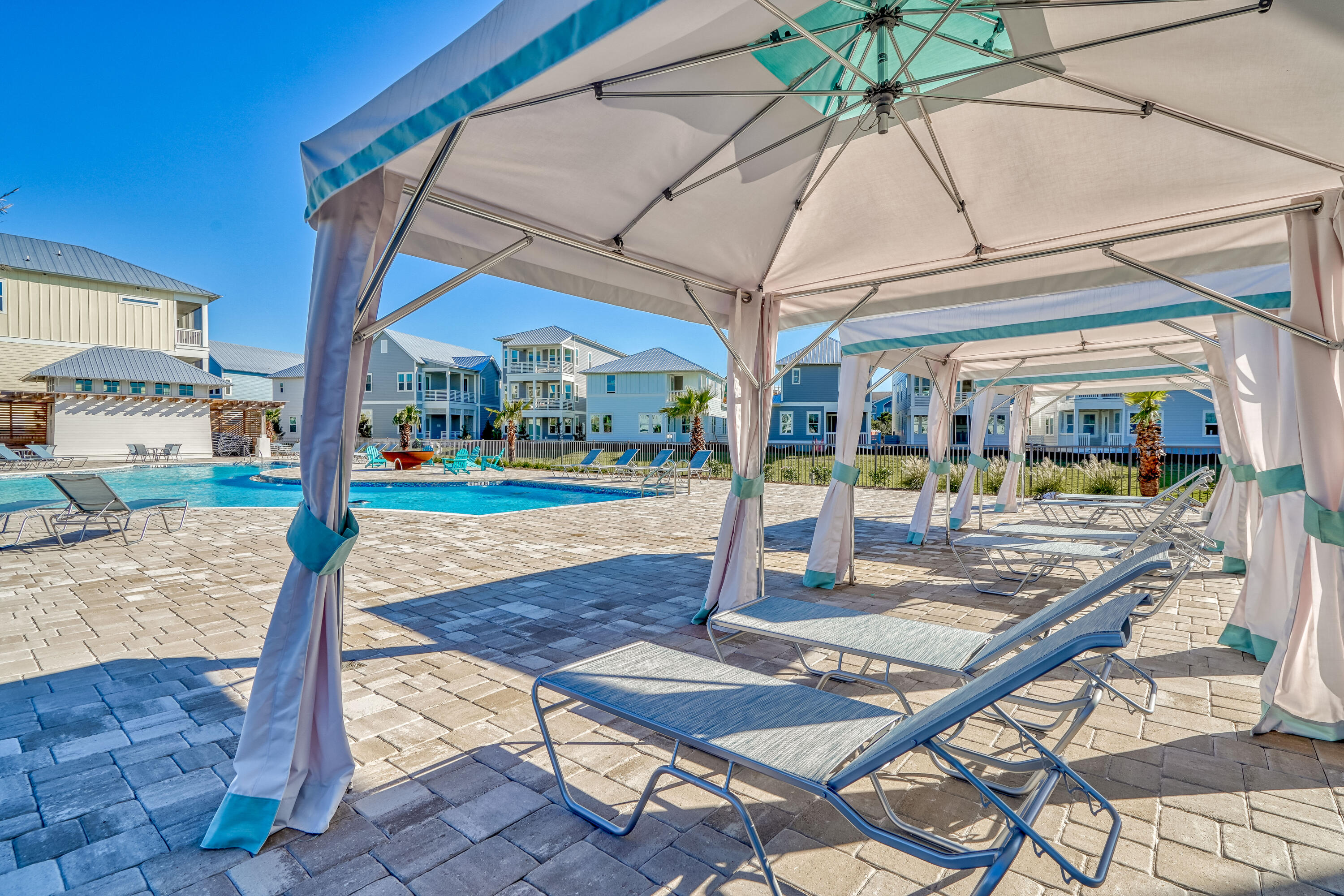 144 Wharf Ln Inlet Beach, Unit A Inlet Beach, FL 32461 - Photo 34 of 48 a view of a patio with a table and chairs