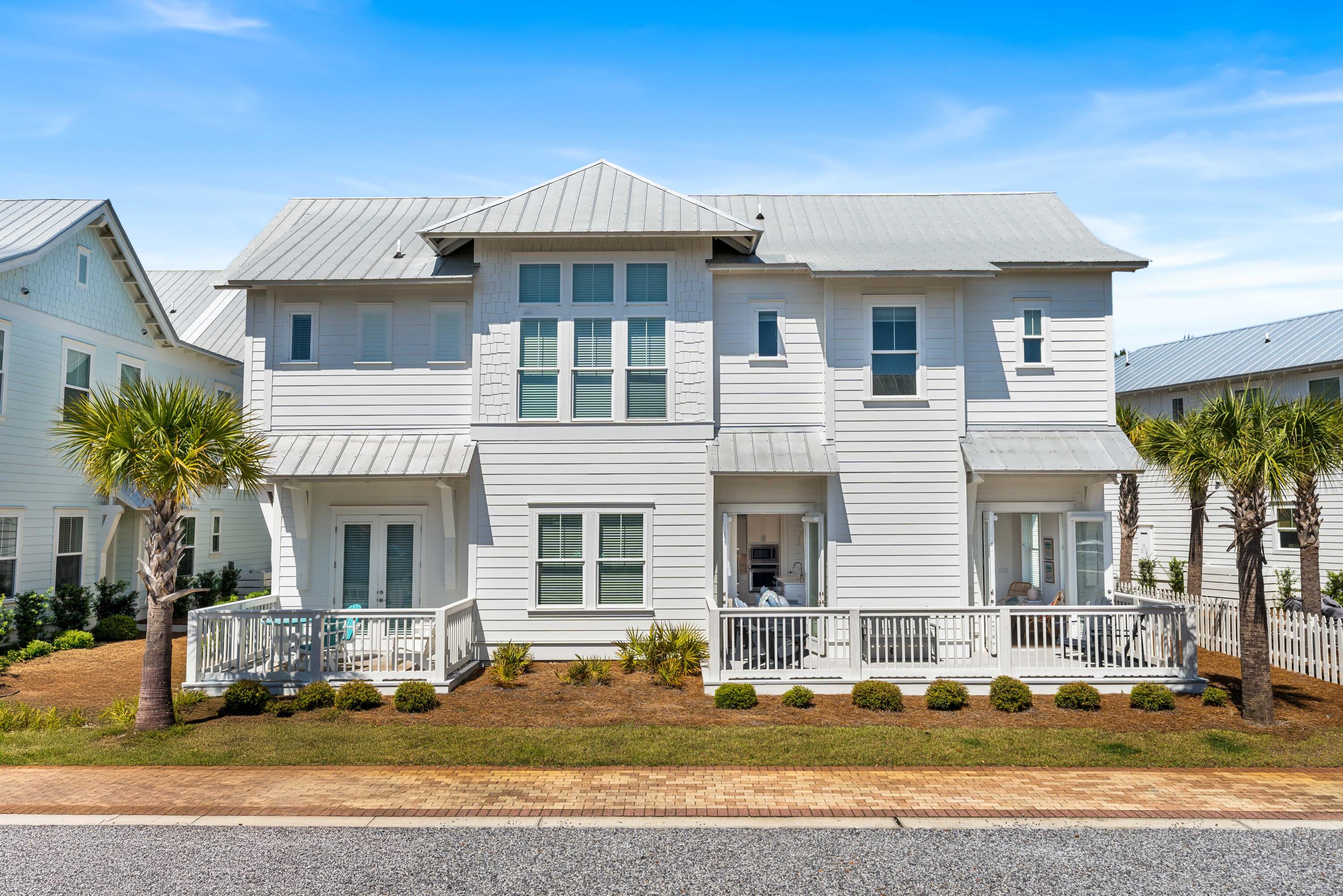 144 Wharf Ln Inlet Beach, Unit A Inlet Beach, FL 32461 - Photo 40 of 48 a front view of a house with a yard