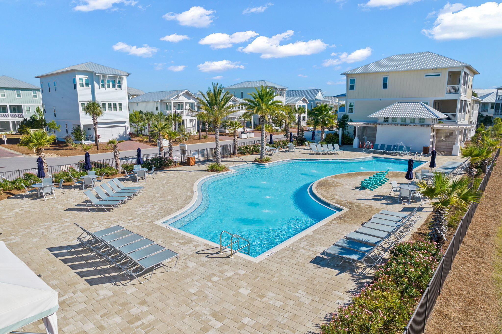 144 Wharf Ln Inlet Beach, Unit A Inlet Beach, FL 32461 - Photo 46 of 48 a view of a swimming pool and lounge chairs