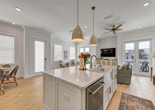 144 Wharf Ln Inlet Beach, Unit A Inlet Beach, FL 32461 - Photo 5 of 48 an open kitchen with stainless steel appliances granite countertop a stove and a view of living room