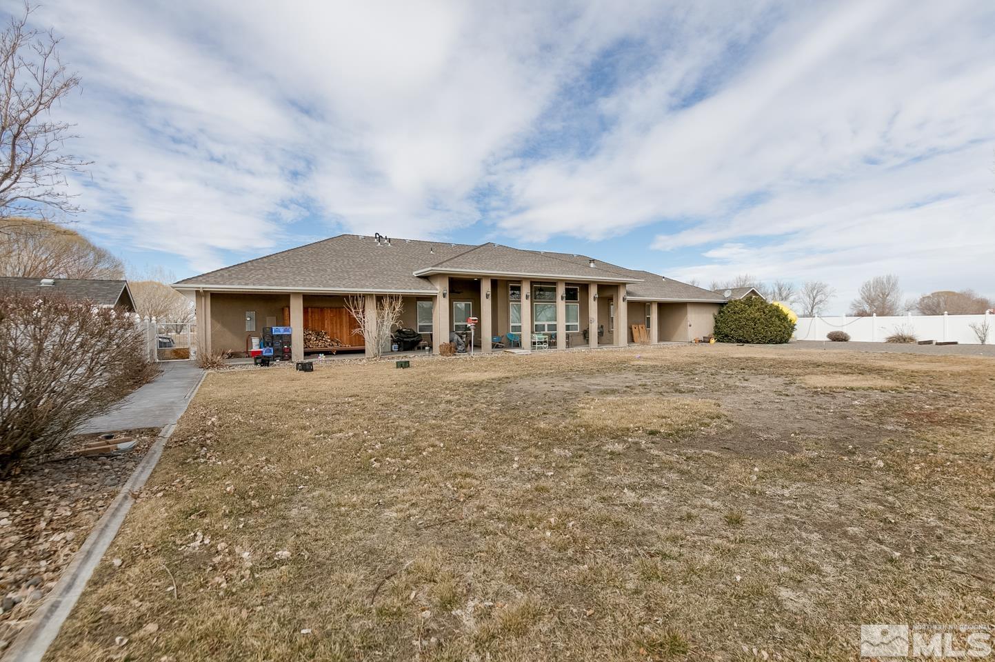 3774 Red Mountain Road Fallon, NV 89406 - Photo 31 of 37 a front view of a house with a yard