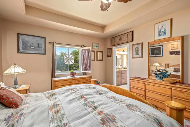 a bathroom with double vanity sink and a mirror