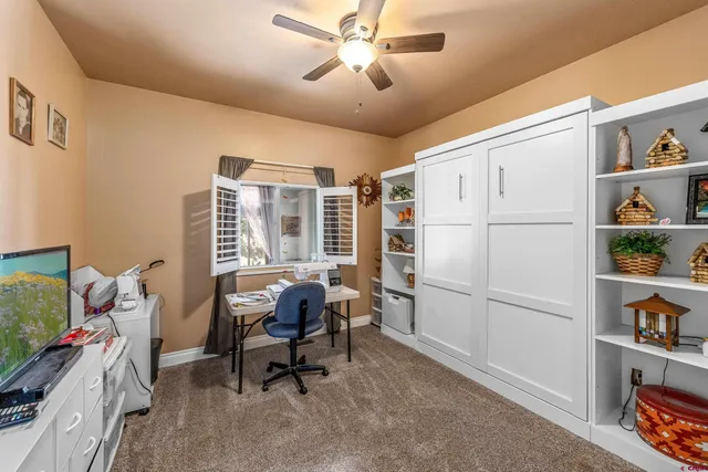 a workspace with furniture and window