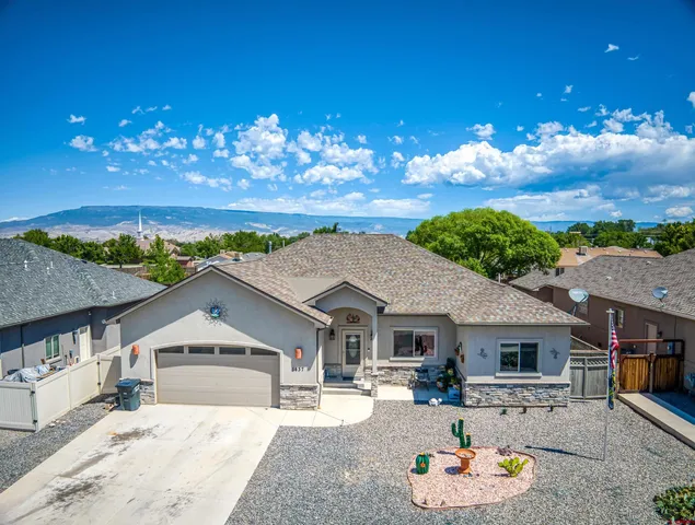 an aerial view of a house with a swimming pool yard and outdoor seating