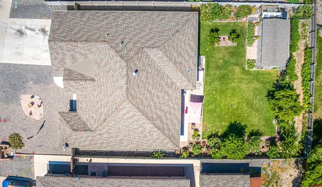 an aerial view of multiple houses with outdoor space