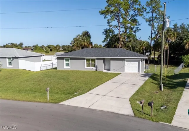 front view of a house with a yard