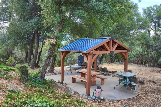 an outdoor space with furniture and umbrella
